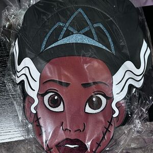 Character Face Pillow with Black and White Design